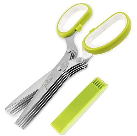 A picture containing tool, scissors

Description automatically generated