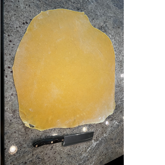 A knife and a dough on a counter

AI-generated content may be incorrect.