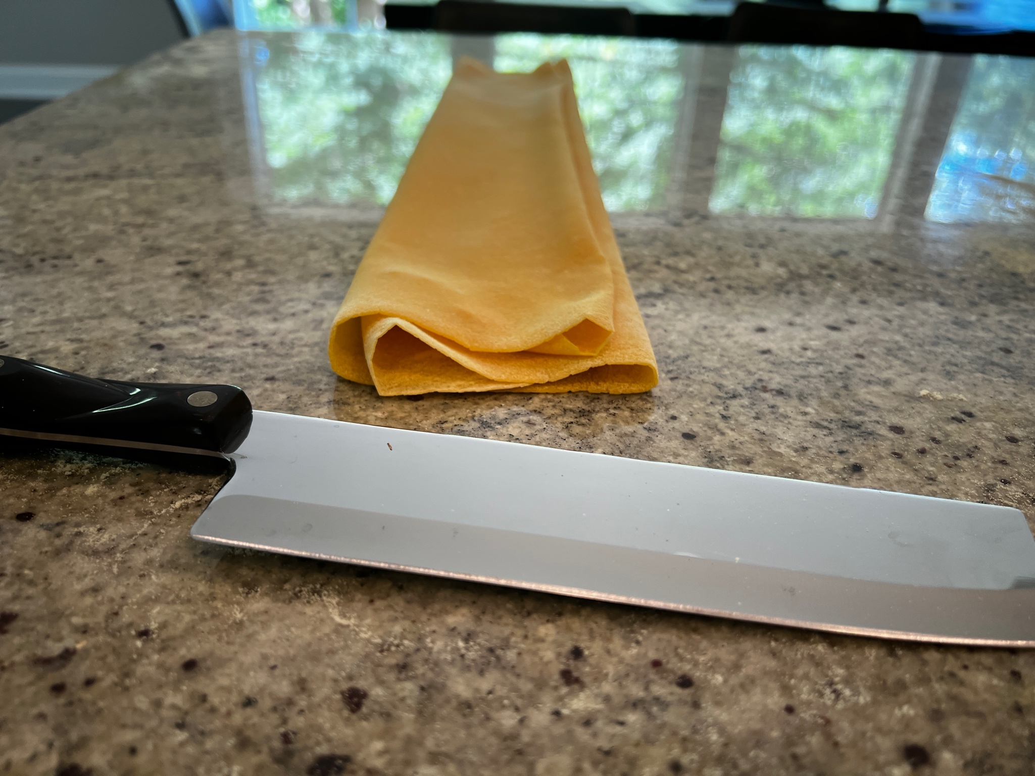 A knife and a napkin on a counter

AI-generated content may be incorrect.